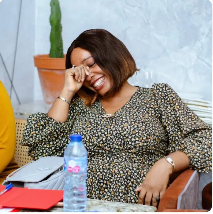 A student laughing at a table during a session
