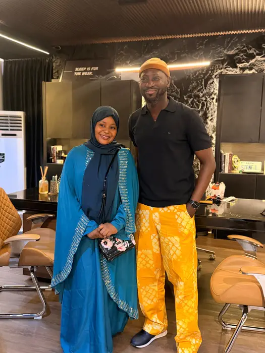 Two people standing together during a visit to an industry office