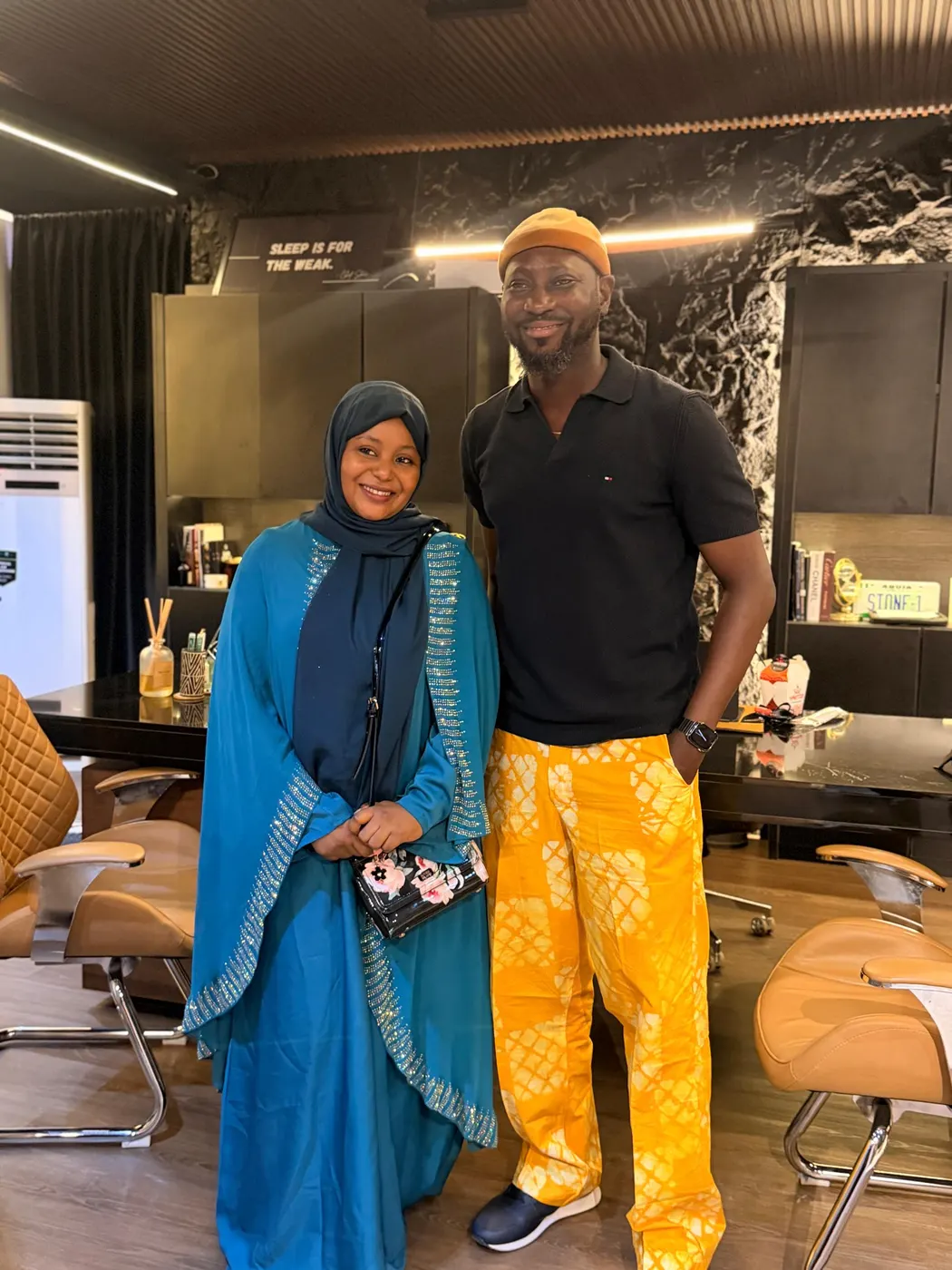 Two people standing together during a visit to an industry office